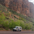 Man Standing Outside Moterra Luxury Sprinter Rental on Road Trip of Zion, Bryce Canyon and Arches National Parks